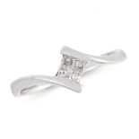 A DIAMOND DRESS RING in 18ct white gold, the twisted shank is set with four princess cut diamonds,