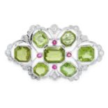 A PERIDOT, RUBY AND DIAMOND BROOCH, CIRCA 1940 of hexagonal design, set with seven graduated emerald