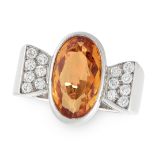 A DIAMOND AND IMPERIAL TOPAZ RING in 18ct white gold, set with an oval cut Imperial topaz of