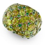 A PERIDOT AND EMERALD BOMBE RING in 18ct rose gold, the bombe face set with oval cut peridot and