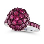 A RUBY DRESS RING designed as a ruby half eternity, with a central sphere set all over with round