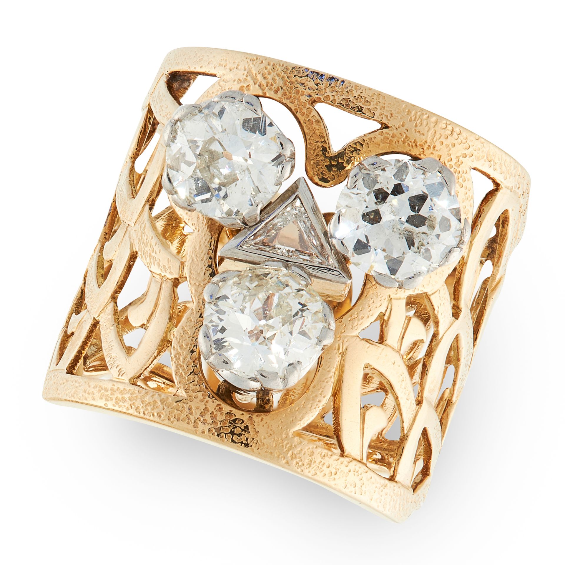 A DIAMOND DRESS RING in yellow gold, in open framework design, set with a trio of round cut diamonds