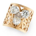 A DIAMOND DRESS RING in yellow gold, in open framework design, set with a trio of round cut diamonds