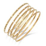 A SET OF FIVE GOLD BANGLES, with textured design, inner diameter: 6.5cm, 24.7g.