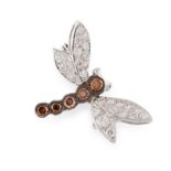 A BROWN AND WHITE DIAMOND DRAGONFLY BROOCH in 18ct white gold, designed as a dragonfly, the body set