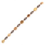 A CITRINE BRACELET set with six oval cut citrine totalling approximately 11.00 carats, spaced by