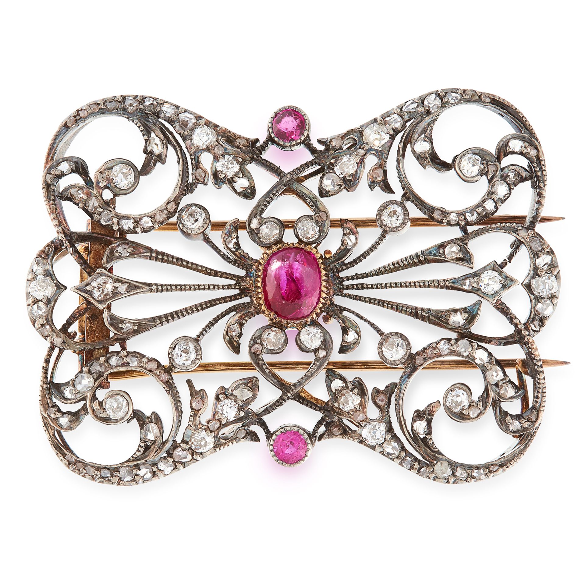 AN ANTIQUE DIAMOND AND RUBY BROOCH in yellow gold and silver, in open framework design, set with