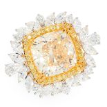 A YELLOW DIAMOND AND DIAMOND DRESS RING in 18ct white and yellow gold, set with a cushion cut