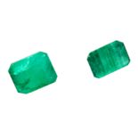 TWO UNMOUNTED EMERALDS totalling 8.62 carats, emerald cut.