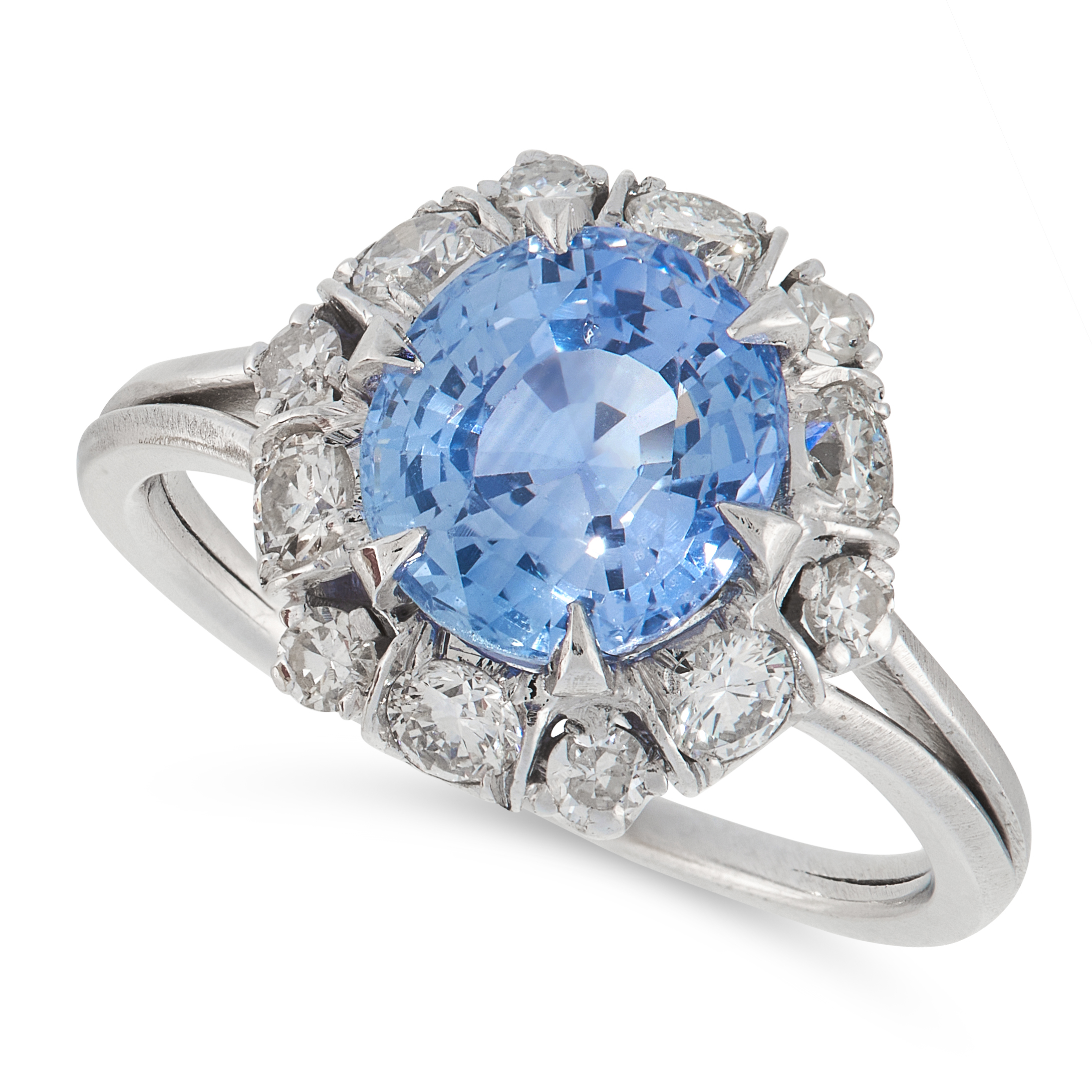 A SAPPHIRE AND DIAMOND CLUSTER RING comprising of an oval cut sapphire of 2.80 carats in a border of