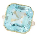 AN AQUAMARINE DRESS RING in yellow gold, set with an emerald cut aquamarine of 14.38 carats, size