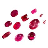 A MIXED LOT OF UNMOUNTED SYNTHETIC RUBIES totalling 70.65 carats including oval cut, emerald cut,