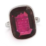 AN ANTIQUE GARNET INTAGLIO AND DIAMOND SEAL / SIGNET RING, EARLY 20TH CENTURY in platinum, set