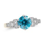 AN ART DECO BLUE ZIRCON AND DIAMOND DRESS RING in 18ct yellow gold and platinum, set with a round