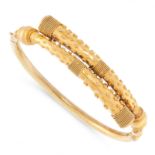 AN ANTIQUE ETRUSCAN REVIVAL BANGLE, 19TH CENTURY in 15ct yellow gold, the twisted band decorated