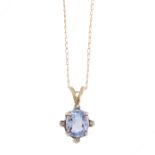 A CEYLON NO HEAT SAPPHIRE AND DIAMOND PENDANT AND CHAIN in yellow gold, set with a cushion cut