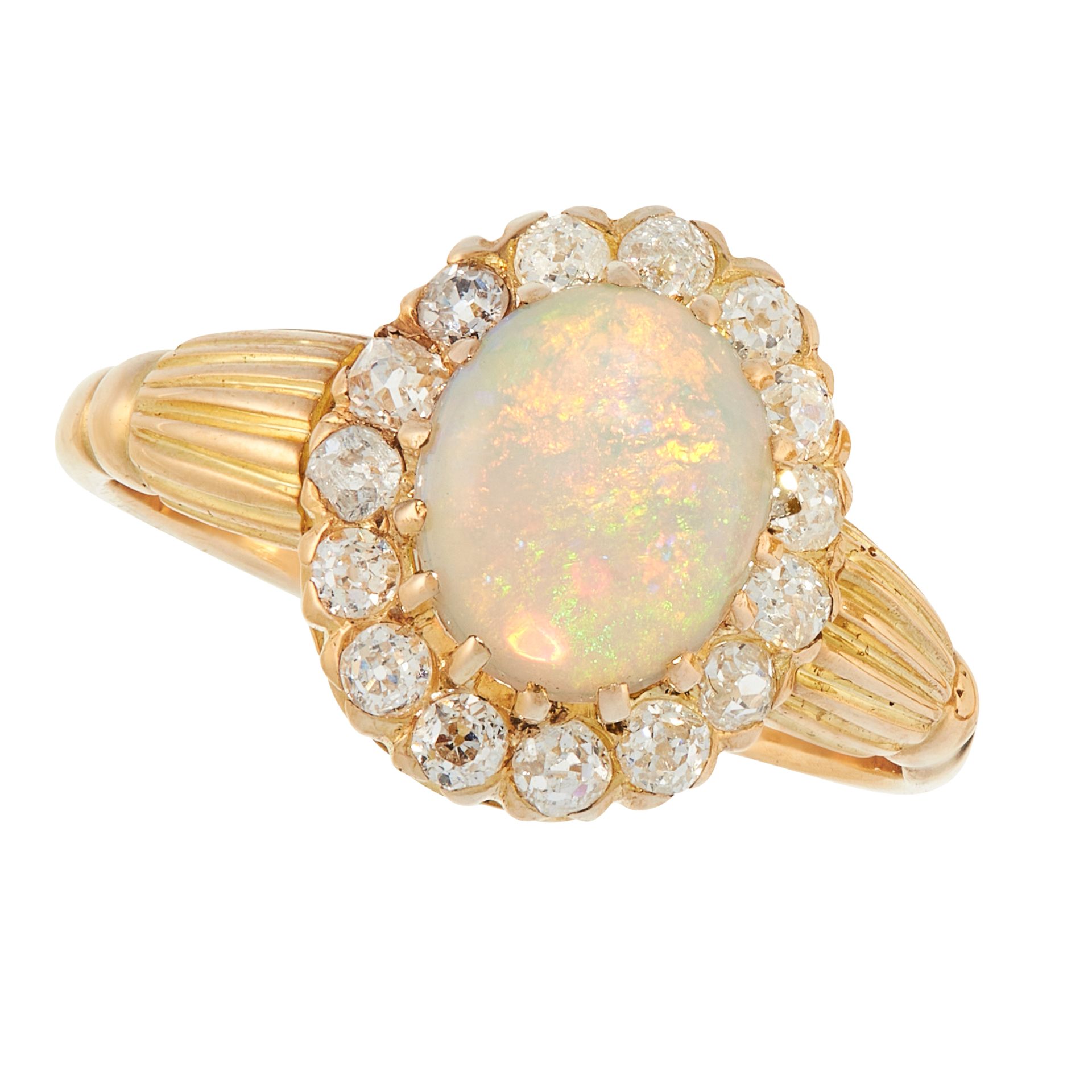 AN ANTIQUE OPAL AND DIAMOND DRESS RING in high carat yellow gold, set with an oval cabochon opal