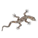 A DIAMOND AND EMERALD LIZARD BROOCH in 18ct white gold, designed as a lizard, its body jewelled