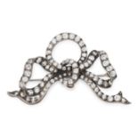 AN ANTIQUE DIAMOND BOW BROOCH, 19TH CENTURY in yellow gold and silver, designed as a ribbon tied