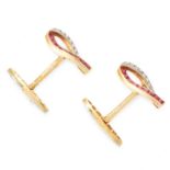 A PAIR OF RUBY AND DIAMOND CUFFLINKS, EARLY 20TH CENTURY in high carat yellow gold, set with step
