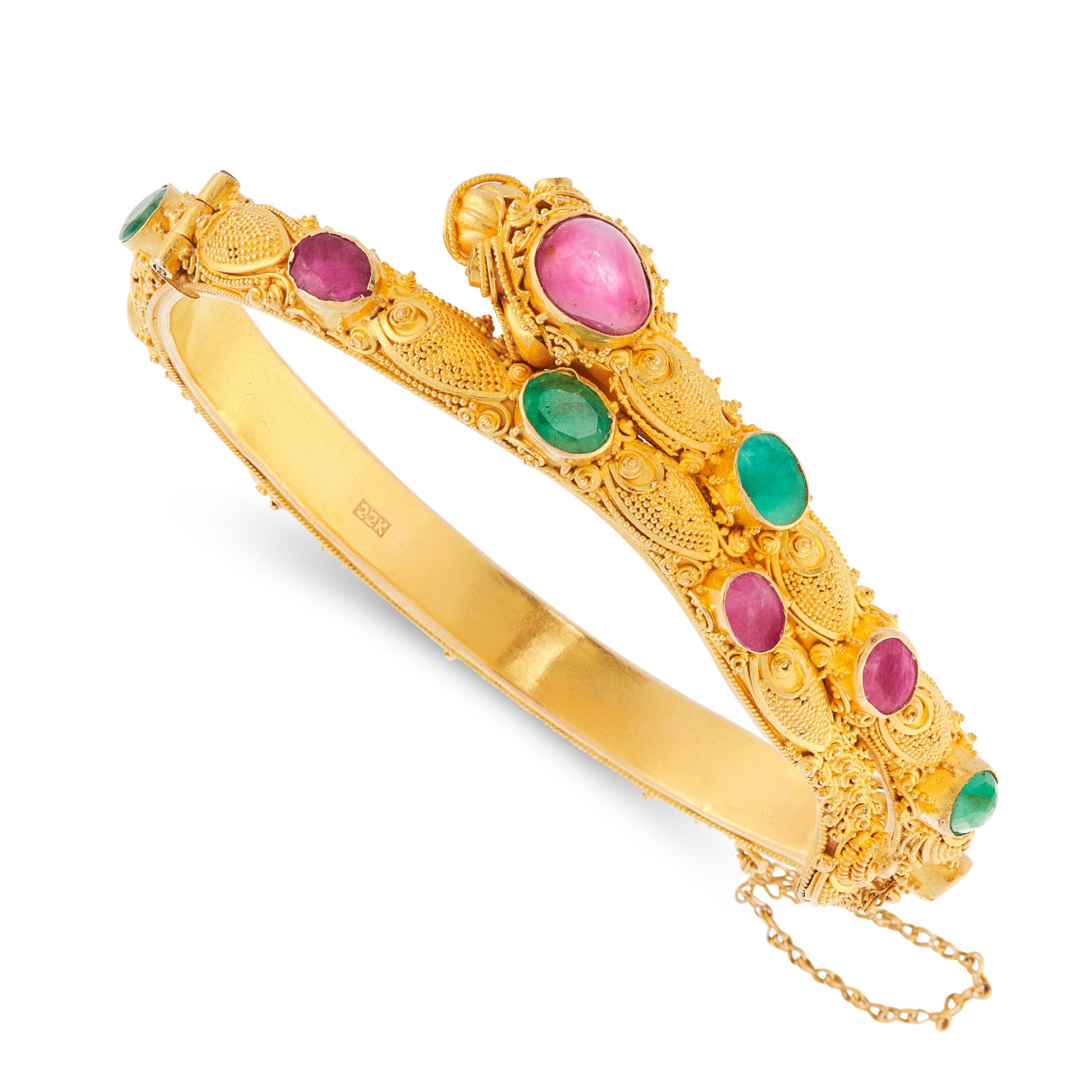 A RUBY AND EMERALD CHINESE DRAGON BANGLE in 22ct yellow gold, designed as the body of a dragon