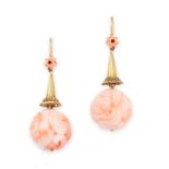 A PAIR OF ANTIQUE CARVED CORAL EARRINGS in yellow gold, each set with a Chinese carved coral bead of