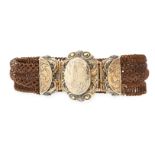 AN ANTIQUE HAIRWORK MOURNING LOCKET BRACELET, 19TH CENTURY the bracelet formed of four rows of woven