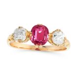 AN ANTIQUE RUBY AND DIAMOND DRESS RING in high carat yellow gold, set with a cushion cut ruby of 0.