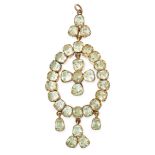 AN ANTIQUE CHRYSOLITE PENDANT, 19TH CENTURY in yellow gold, set with five fancy cut chrysolite in