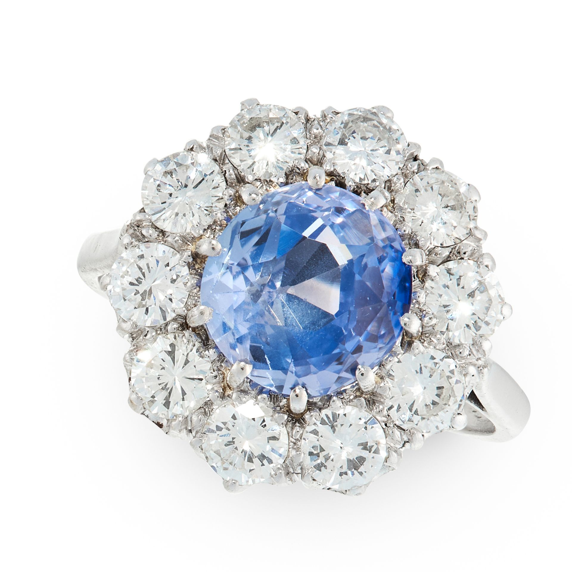 A CEYLON NO HEAT SAPPHIRE AND DIAMOND DRESS RING in 18ct white gold and platinum, set with a cushion