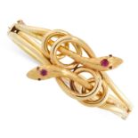 AN ANTIQUE RUBY SNAKE BANGLE, 19TH CENTURY in 18ct yellow gold, formed of two snaked coiled around