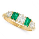 AN ANTIQUE DIAMOND AND EMERALD DRESS RING, 1910 in 18ct yellow gold, set with a trio of old cut