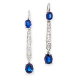 A PAIR OF SAPPHIRE AND DIAMOND EARRINGS each set with two graduated oval cut sapphires accented by