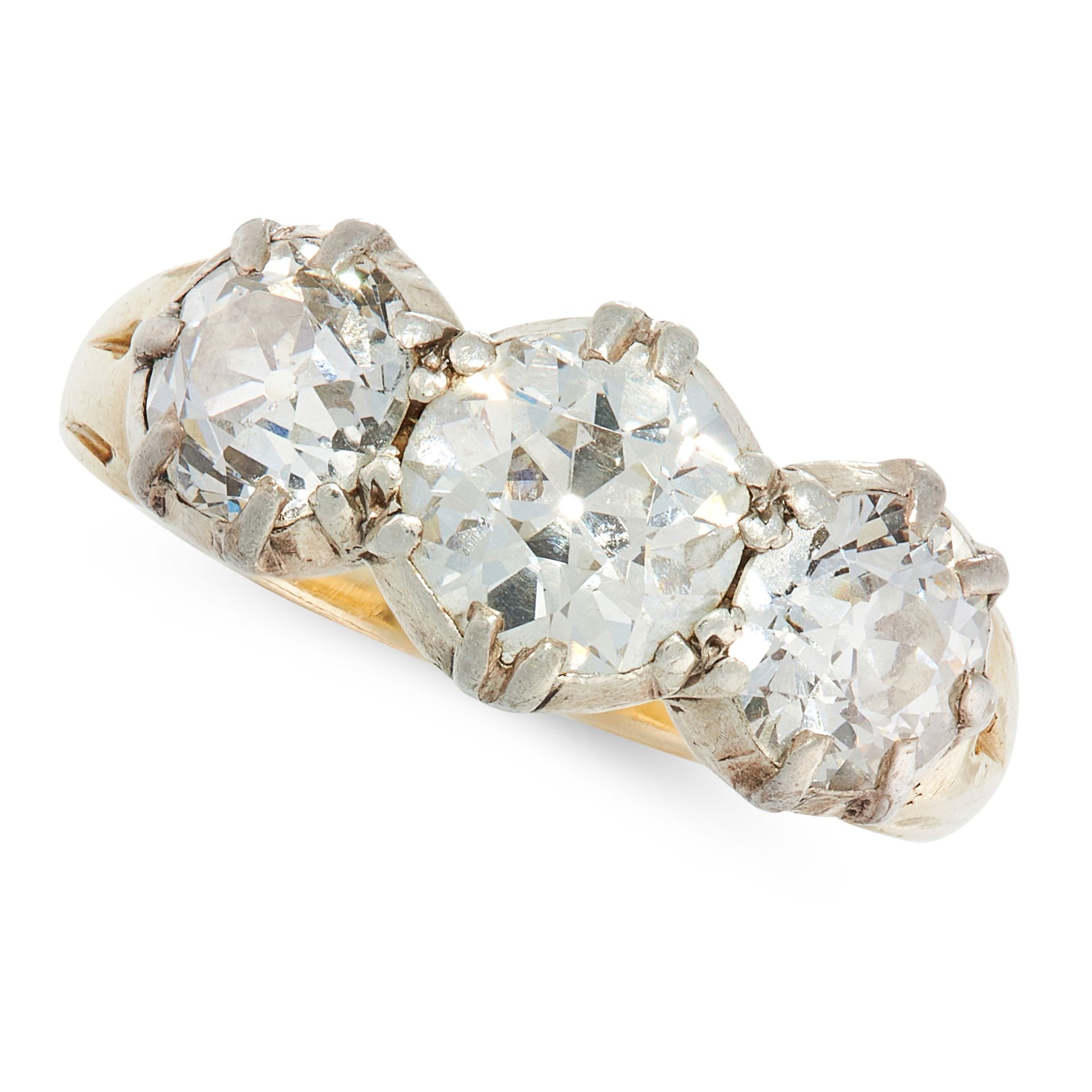 AN ANTIQUE DIAMOND DRESS RING in yellow gold and silver, set with a trio of graduated old cut