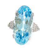 AN AQUAMARINE AND DIAMOND DRESS RING set with an oval cut aquamarine of 12.54 carats between stepped