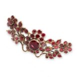 AN ANTIQUE GARNET BROOCH, EARLY 19TH CENTURY in yellow gold and silver, formed as a spray of foliage