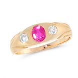 AN ANTIQUE RUBY AND DIAMOND DRESS RING in high carat yellow gold, set with a cushion cut ruby