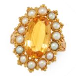 AN ANTIQUE IMPERIAL TOPAZ AND PEARL DRESS RING, 19TH CENTURY in yellow gold, set with an oval cut