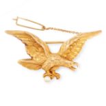 A PEARL EAGLE BROOCH, EARLY 20TH CENTURY in 18ct yellow gold, designed as an eagle flying, holding a