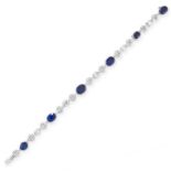 A SAPPHIRE AND DIAMOND BRACELET in 18ct gold and platinum, set with six cushion cut blue sapphires