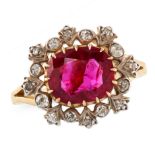 AN UNHEATED RUBY AND DIAMOND CLUSTER RING in 18ct yellow gold, set with a cushion cut ruby of 2.41