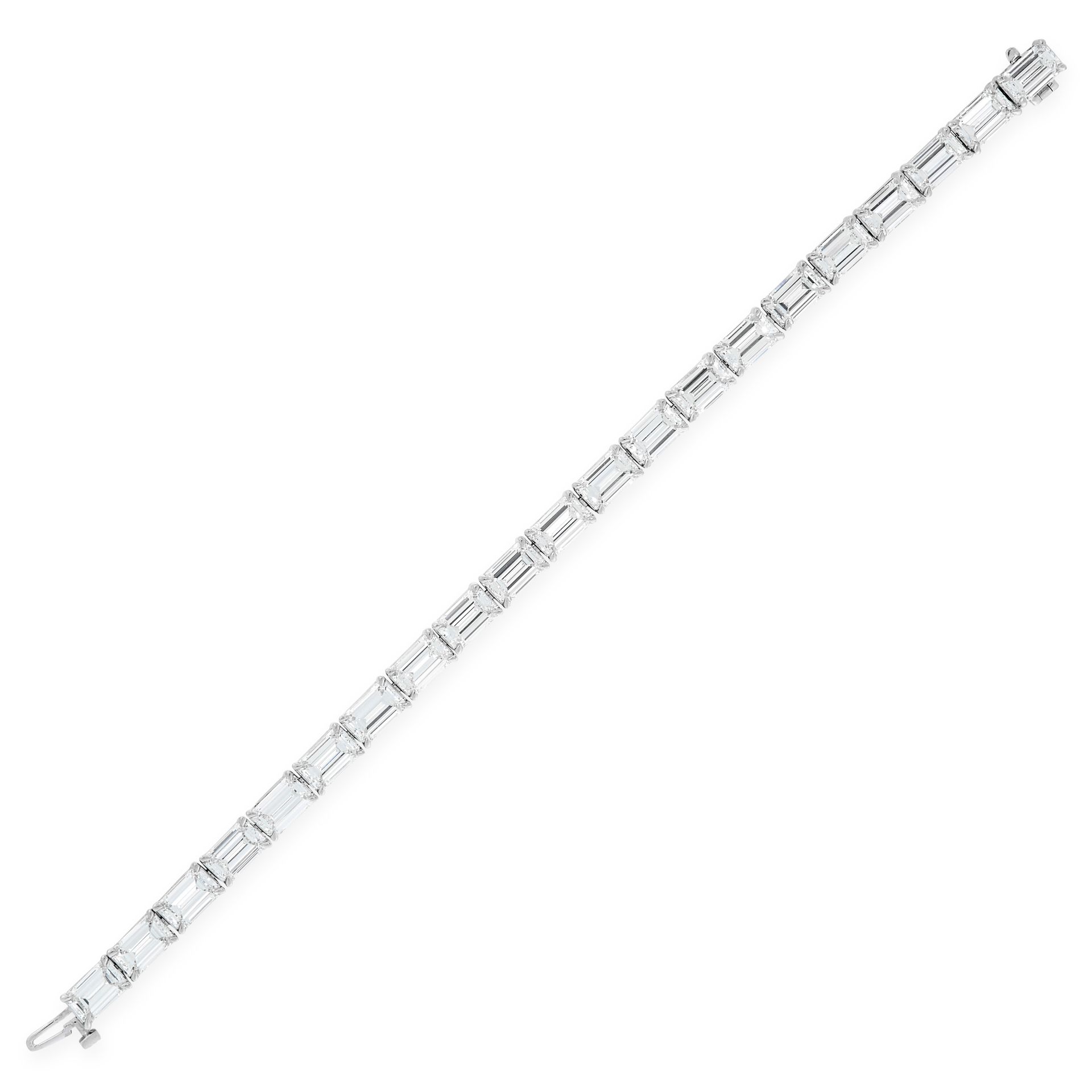 AN IMPORTANT DIAMOND LINE BRACELET in platinum, comprising a single row of emerald cut diamonds, the