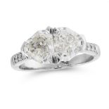 A DIAMOND DRESS RING in platinum, set with two fancy shield shaped step cut diamonds of 1.26 and 1.