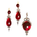 AN ANTIQUE GARNET AND DIAMOND MOURNING LOCKET PENDANT AND EARRINGS SUITE, 19TH CENTURY in high carat