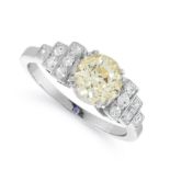 A FANCY YELLOW DIAMOND AND WHITE DIAMOND ENGAGEMENT RING in platinum, set with an old European cut