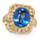 A SAPPHIRE AND DIAMOND DRESS RING in 18ct yellow gold, set with an oval cut blue sapphire of 6.58