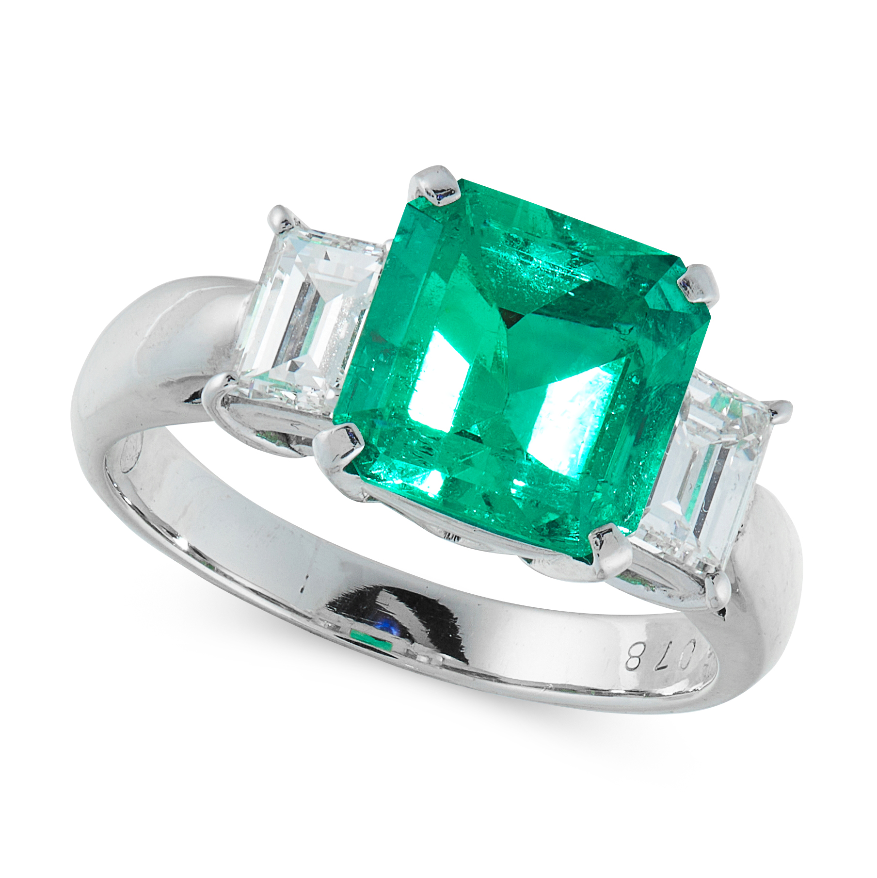 A COLOMBIAN EMERALD AND DIAMOND DRESS RING in platinum, set with an emerald cut emerald of 2.33