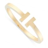 A T SQUARE BRACELET / BANGLE, TIFFANY & CO in 18ct yellow gold, the incomplete band terminated at