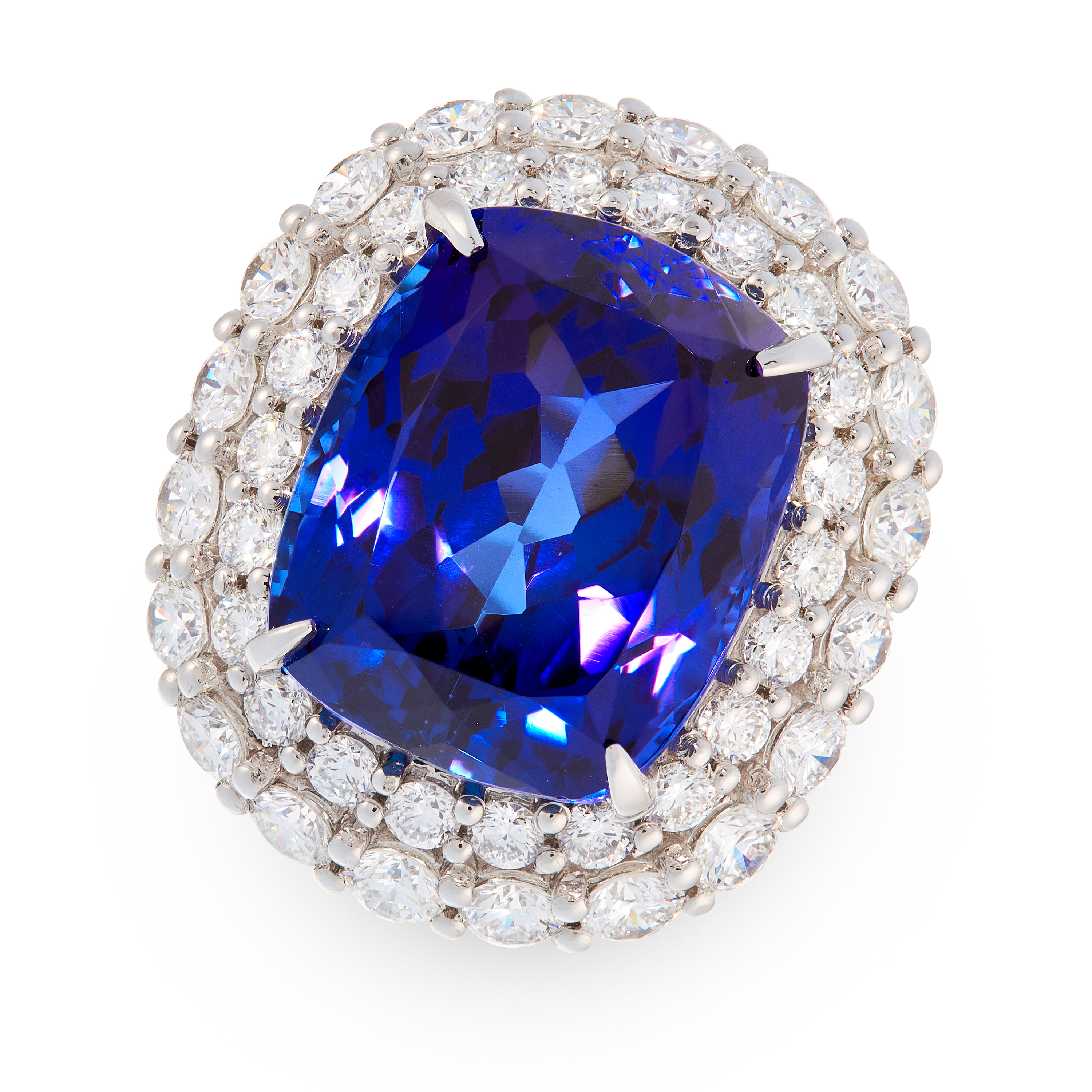 AN EXCEPTIONAL TANZANITE AND DIAMOND DRESS RING in platinum, set with a cushion cut tanzanite of