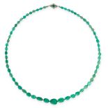 AN ART DECO EMERALD BEAD AND DIAMOND NECKLACE in white gold, comprising a single row of sixty-one